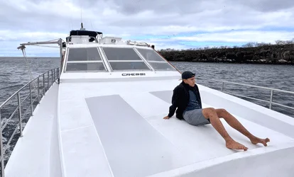 Person observing the sea from a yacht.
