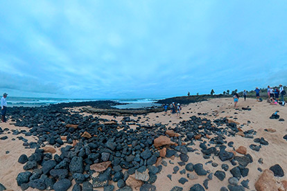 People on the beach Playa de los Perros Santa Cruz island Galapagos.